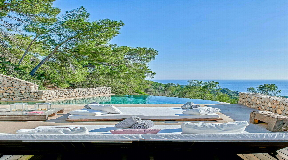 Contemporary and exceptionally stylish five-bedroom villa with fantastic sea views